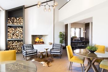 a living room filled with furniture and a fireplace at The Timbers Apartments, Evansville, IN, 47715